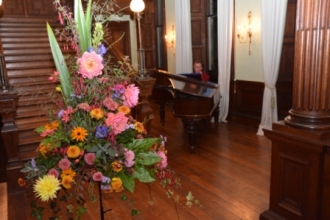  Roger Titley on piano and flowers by Elaine Robinson